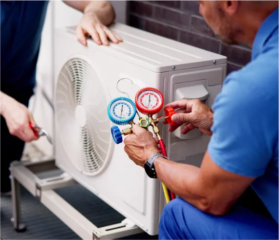 HVAC technician checking an outdoor AC unit for cooling system efficiency